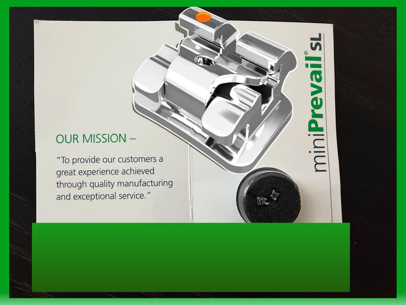 Original mission slide, a photo of a printed page with the bracket model resting on it